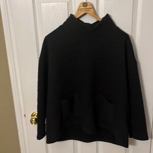 Quilted A-line sweater with front pockets